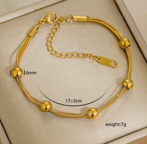 Pulsera triple con bolitas acero inoxidable.