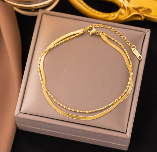 Pulsera doble panza de víbora y granos de arroz acero inoxidable.
